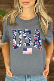 a woman wearing a usa t - shirt with the word usa printed on it