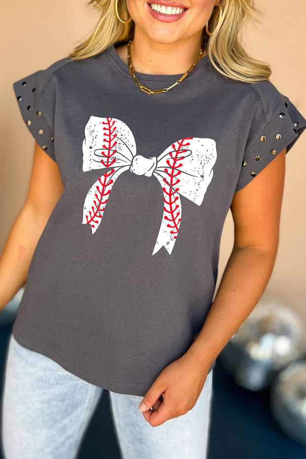 a woman wearing a baseball shirt with a bow