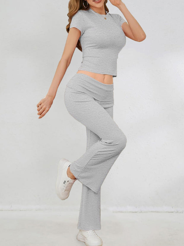 a woman in a gray top and grey pants