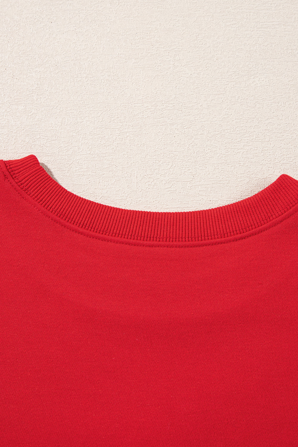 Back neckline close-up of Red Merry Christmas Crewneck Drop Shoulder Loose Sweatshirt, showing smooth fabric and stitching, shop at Faith & Co. Boutique.