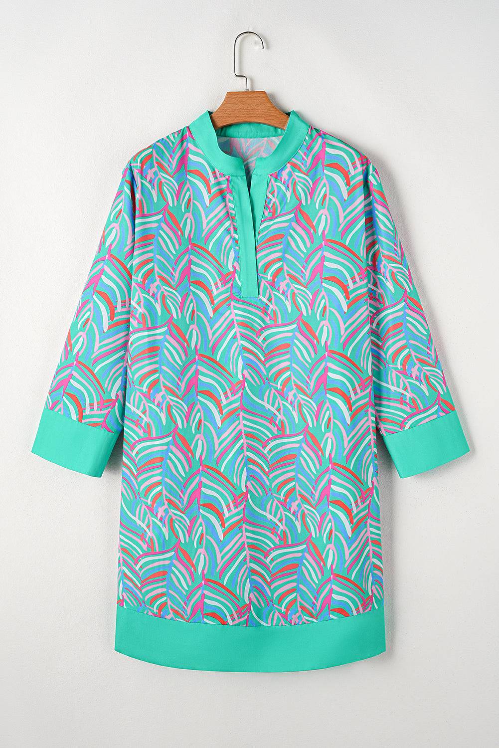 a colorful shirt hanging on a wooden hanger