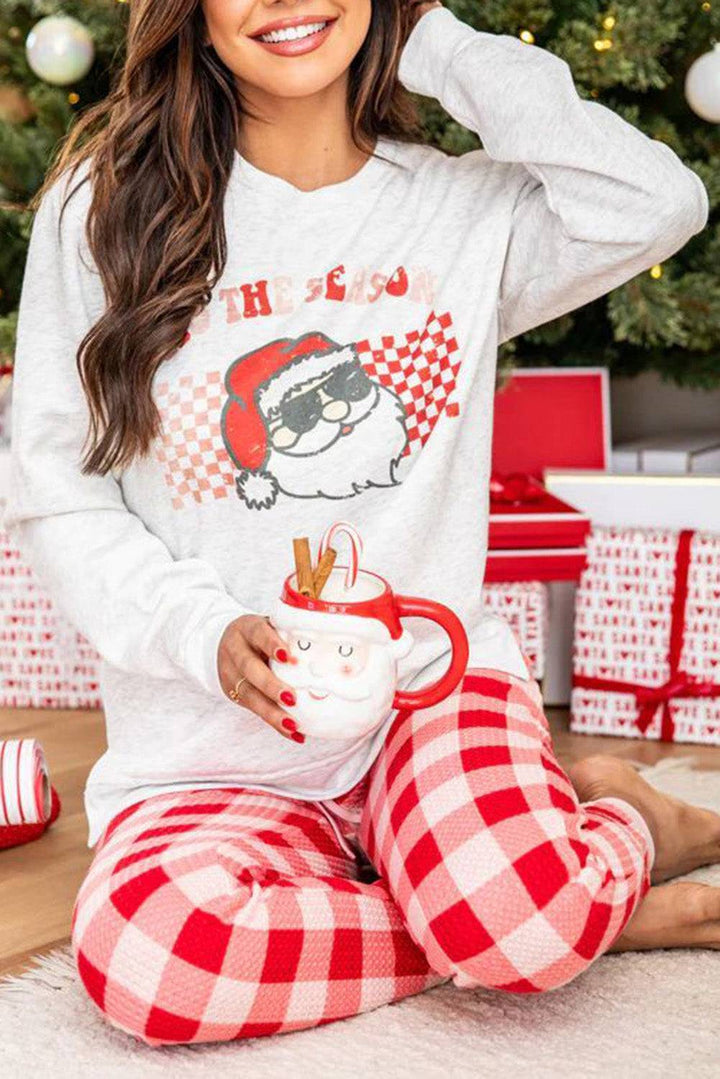 a woman sitting on the floor holding a cup of coffee