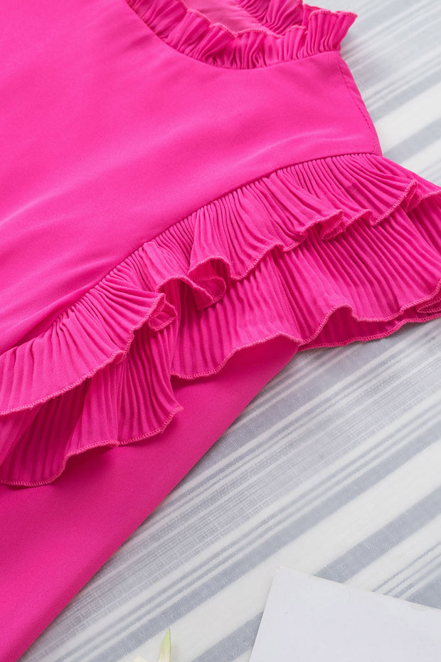 a pink dress laying on top of a bed