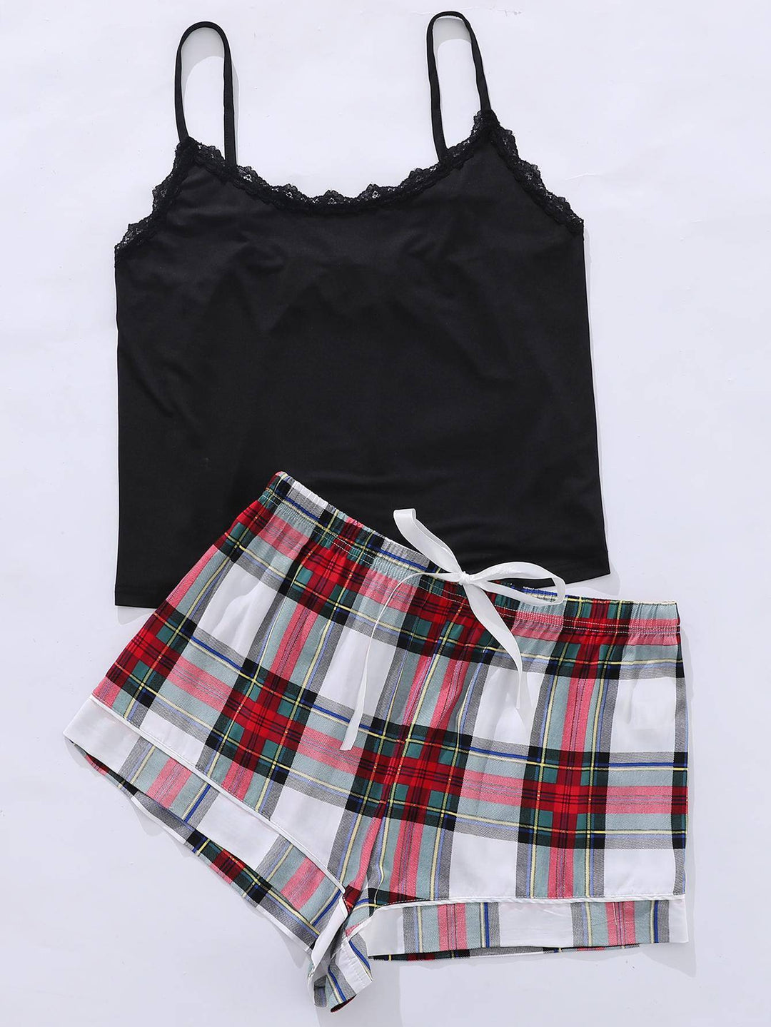 a women's black tank top and plaid shorts