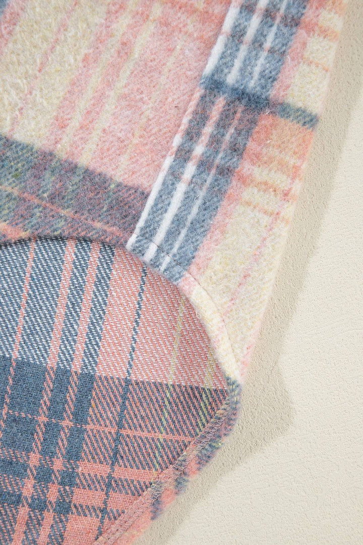 a close up of a plaid fabric on a wall