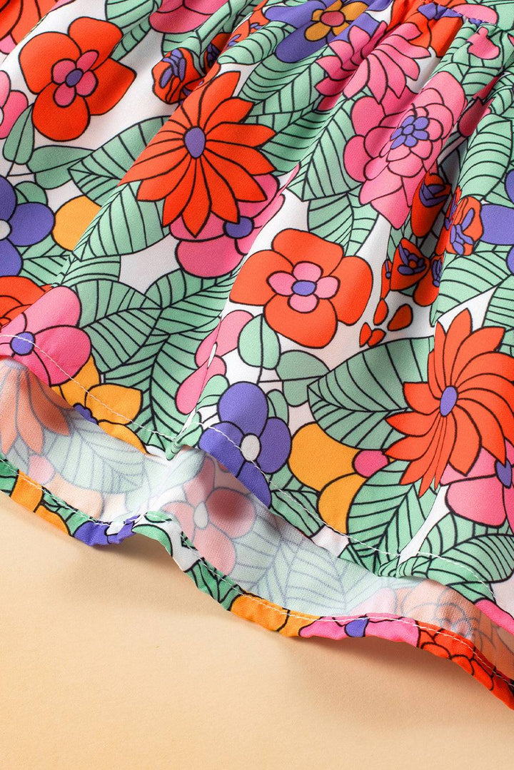 a close up of a flowered dress on a table