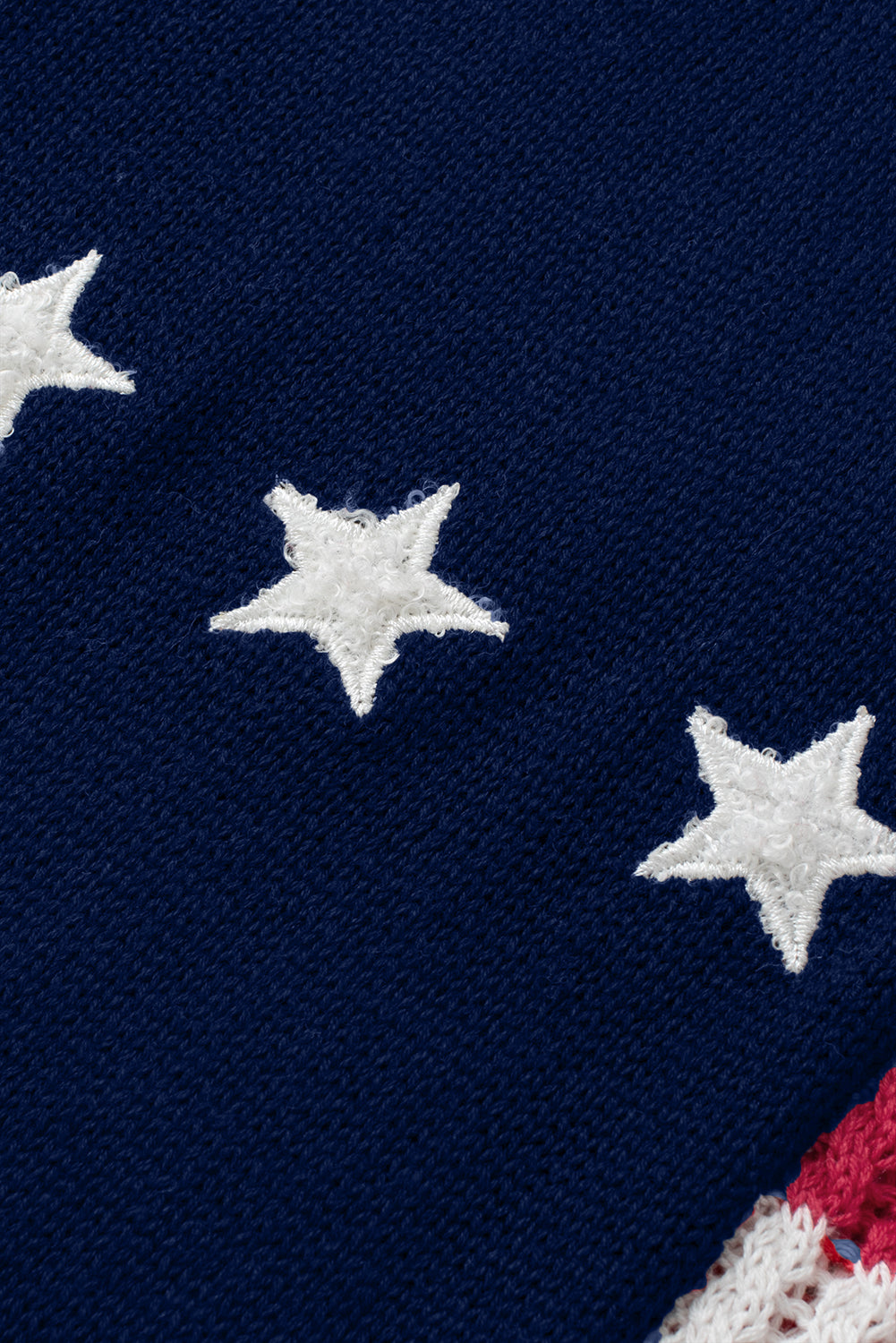 a red, white and blue sweater with stars on it