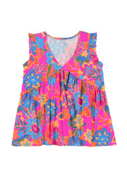 a pink top with blue and orange flowers on it