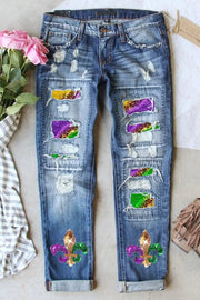 a pair of jeans with colorful patches and flowers