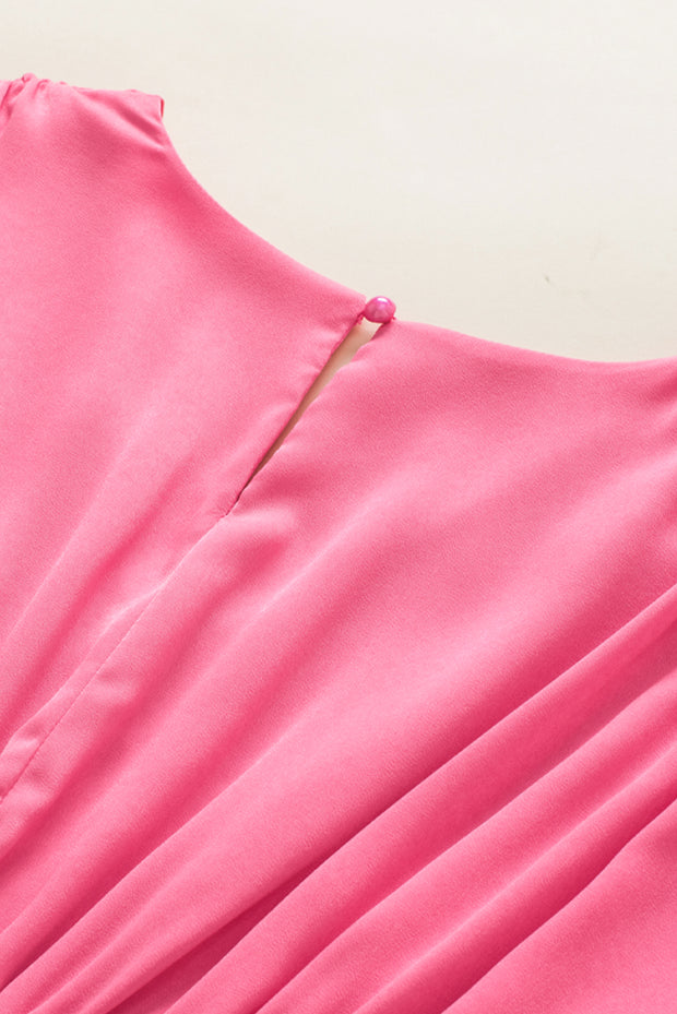 a close up of a pink dress on a mannequin