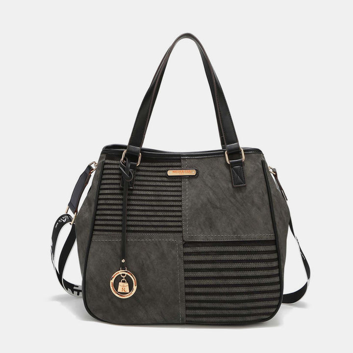 a gray handbag with a black strap