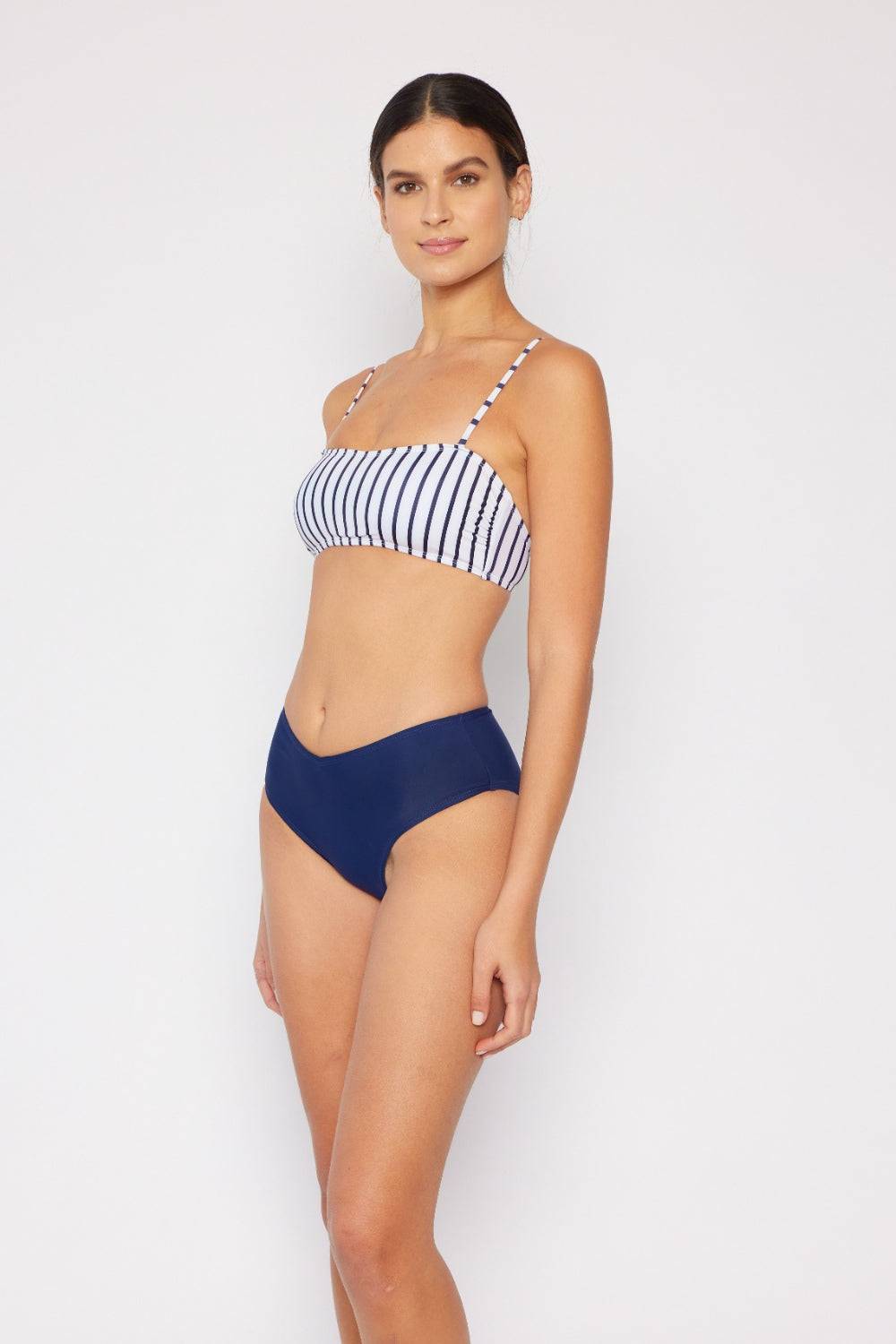 a woman wearing a bikini top and panties