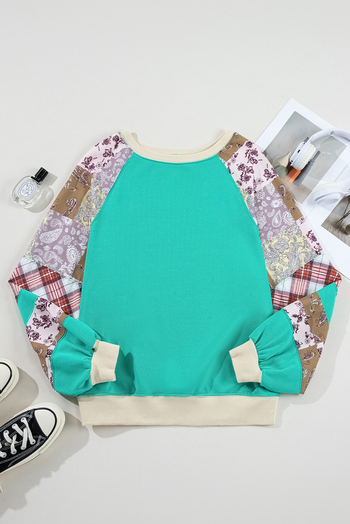 Flat lay of Aruba Blue Plaid Vintage Paisley Patchwork Long Sleeve Raglan Top with accessories. Shop now at Faith & Co. Boutique.