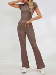 a woman in a brown top and pants