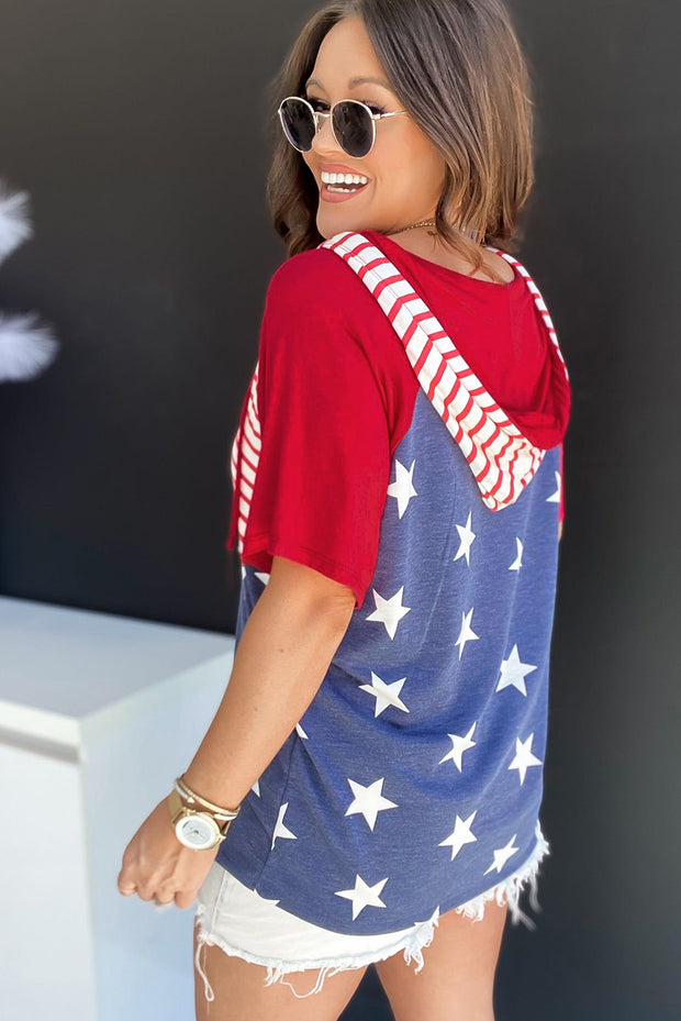 a woman wearing a red, white and blue shirt