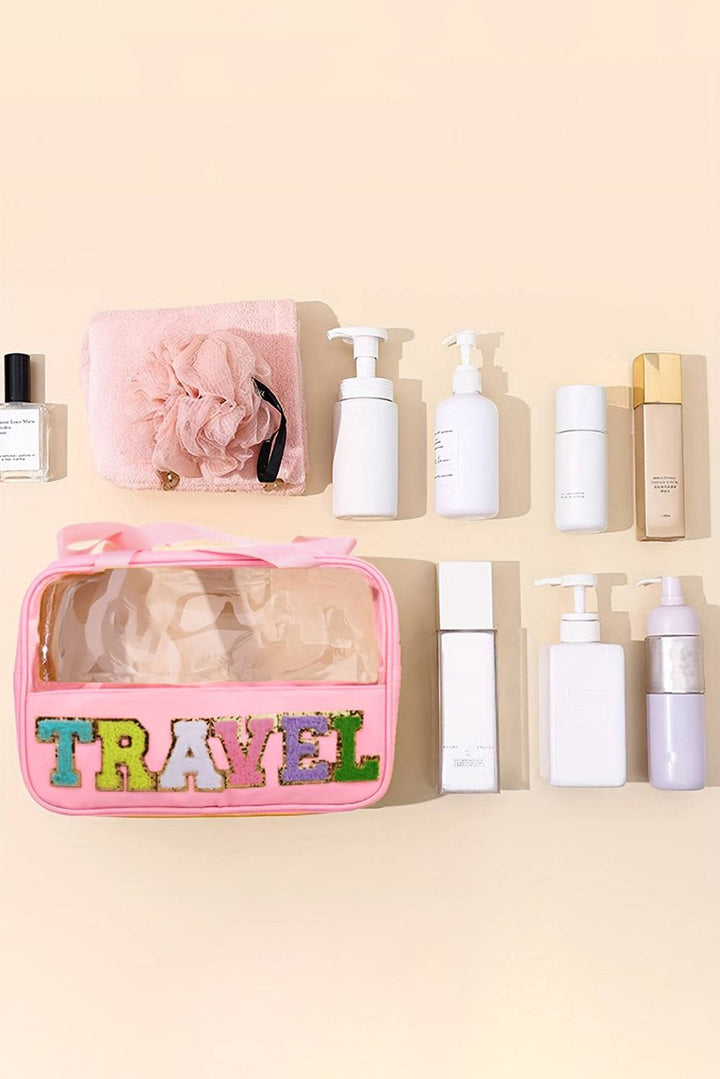 a pink travel bag sitting on top of a counter
