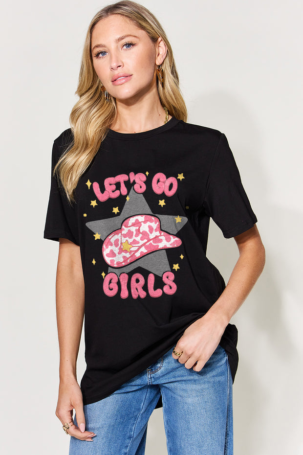 a woman wearing a black t - shirt that says let's go girls