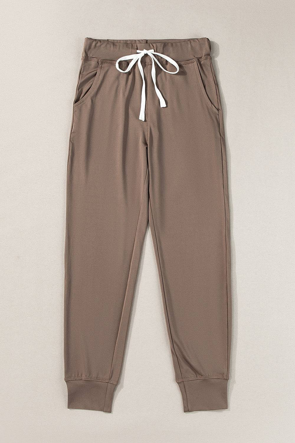 a pair of brown pants with a white drawstring