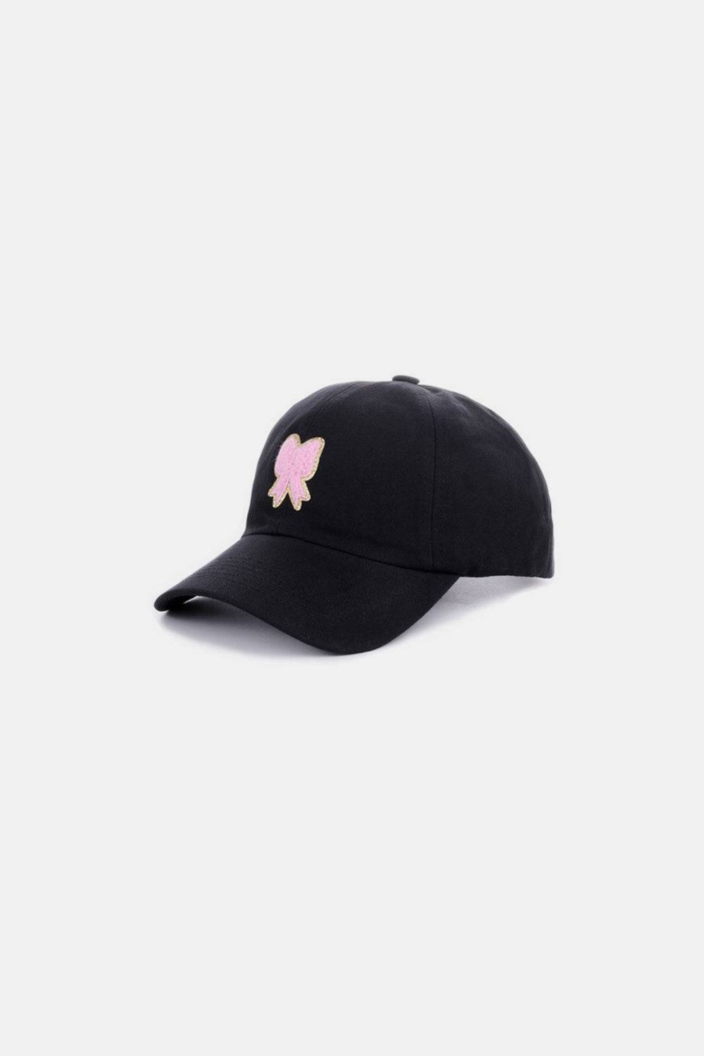 a black hat with a pink pig embroidered on it