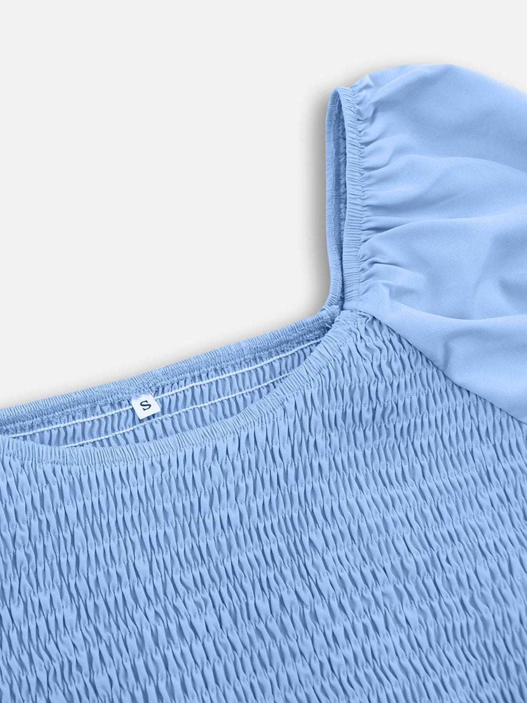 a close up of a blue shirt with a white background
