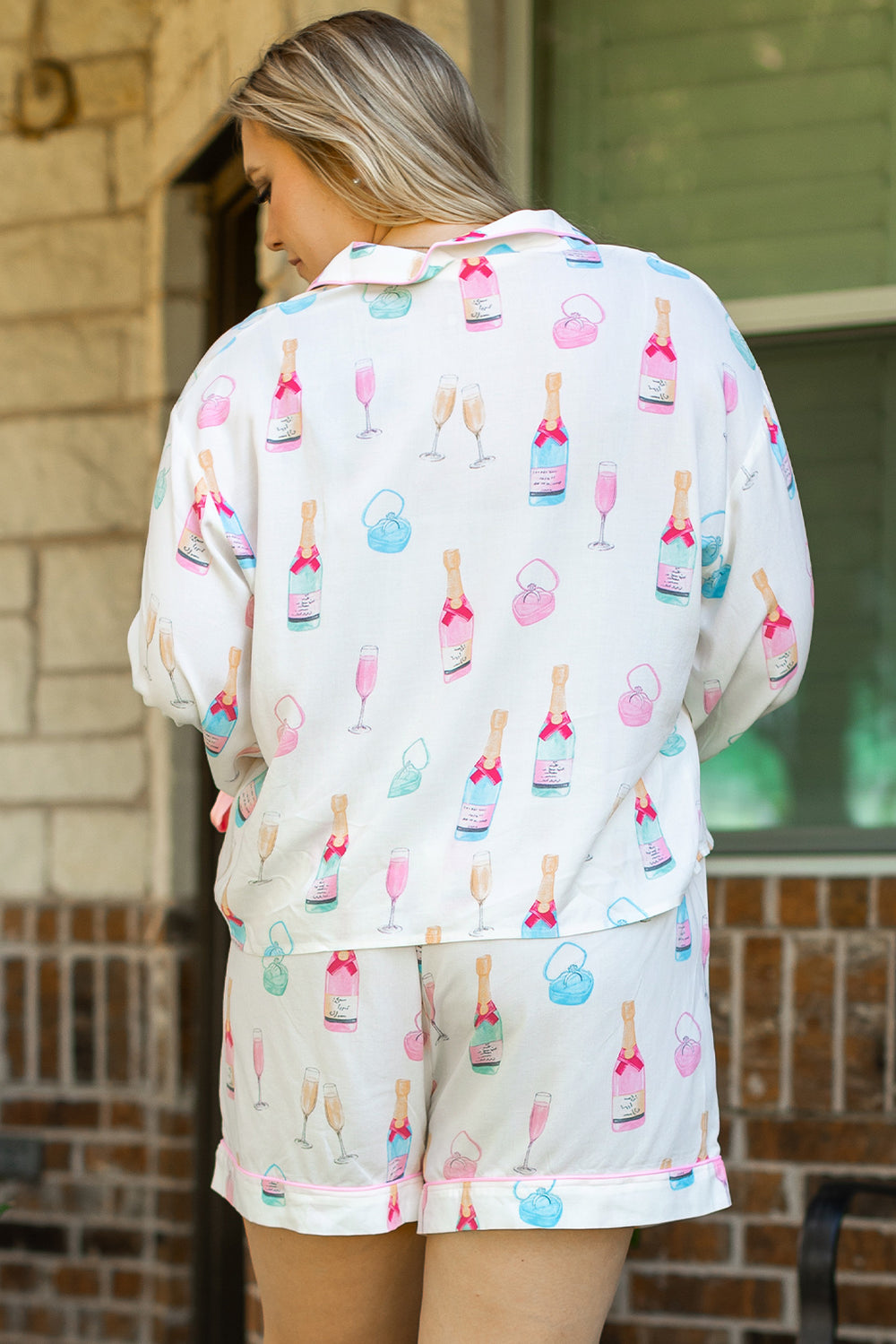 Back view of White Plus Size Wine Glass Print Bow Knot Pajama Set at Faith & Co. Boutique, showcasing colorful wine-themed prints on soft loungewear fabric.