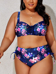 a woman in a floral bikini top and bottom