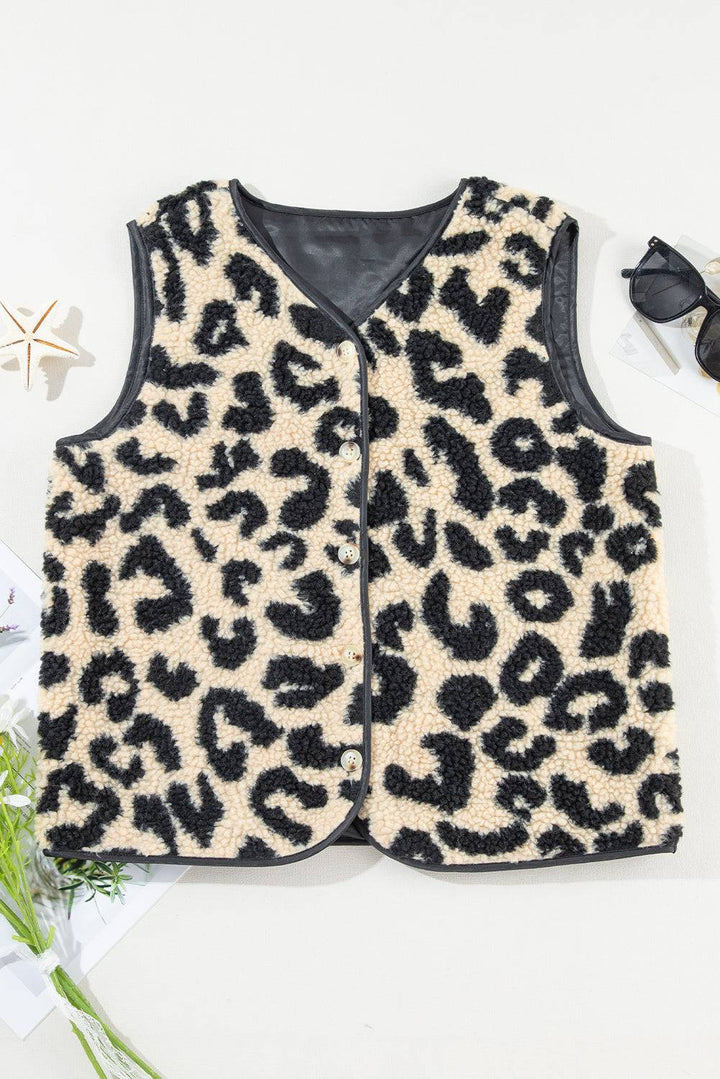 a leopard print vest sitting on top of a table