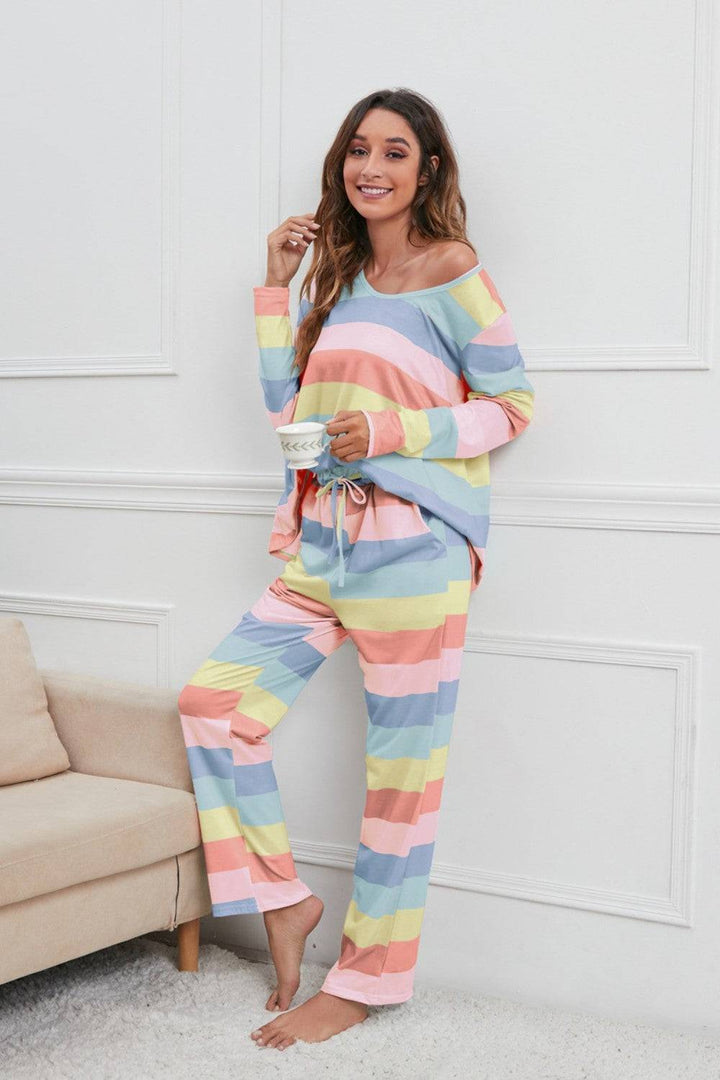 a woman in a colorful striped pajamas posing for the camera