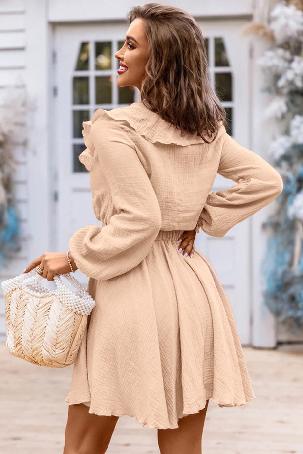 a woman in a beige dress holding a basket