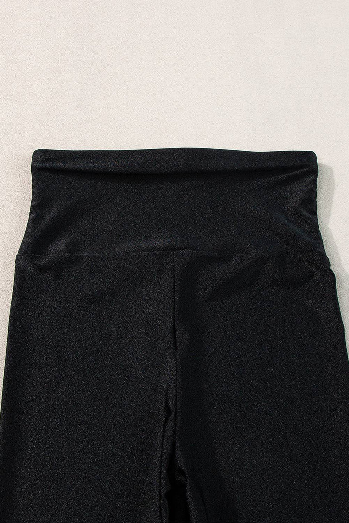 a close up of a person's black pants