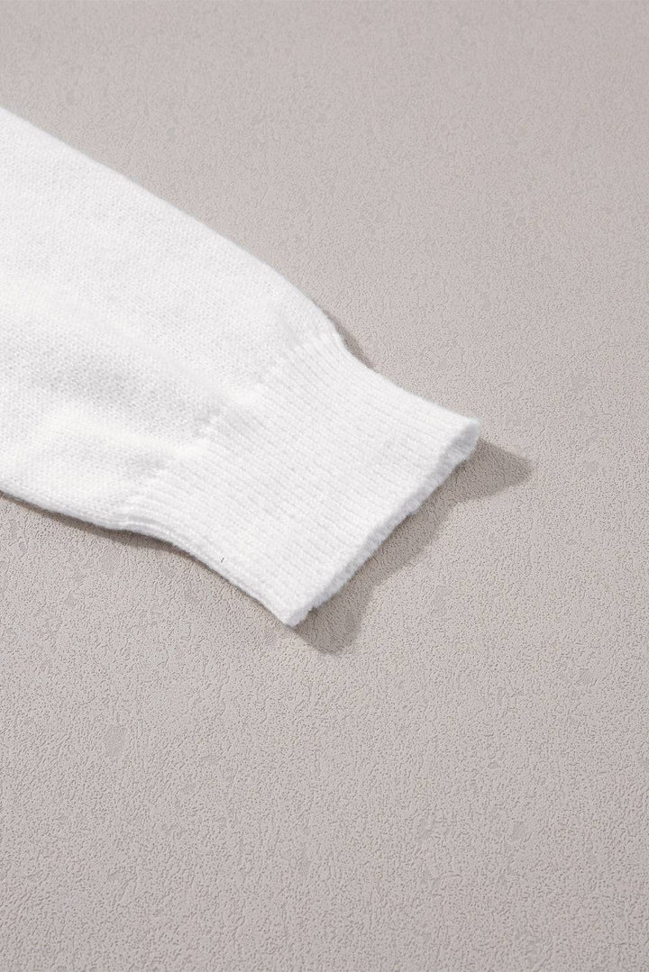 a pair of white socks laying on top of a bed