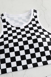 a black and white checkered shirt laying on top of a table