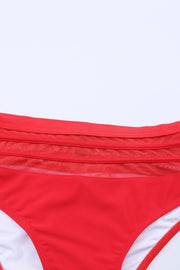 a close up of a red and white bikini bottom