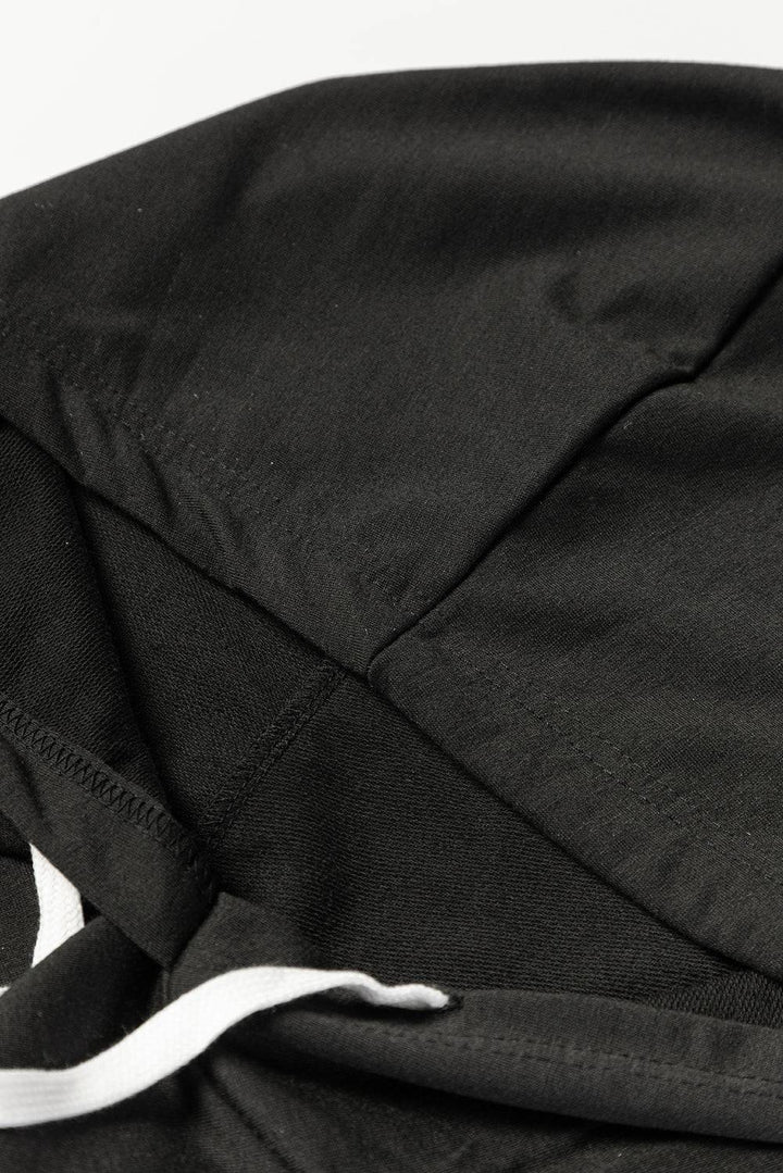 a close up of a black jacket with a white zipper