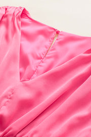 a close up of a pink dress with a zipper