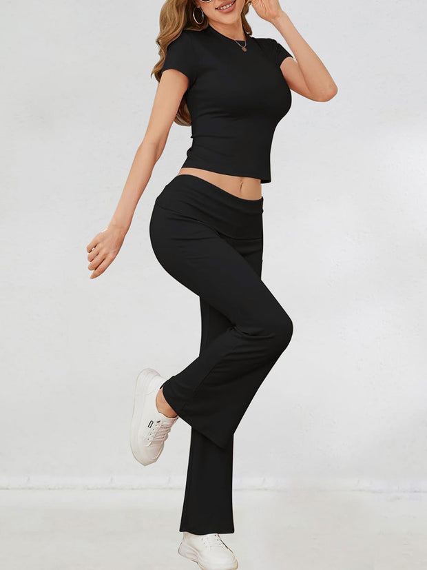 a woman in a black top and black pants