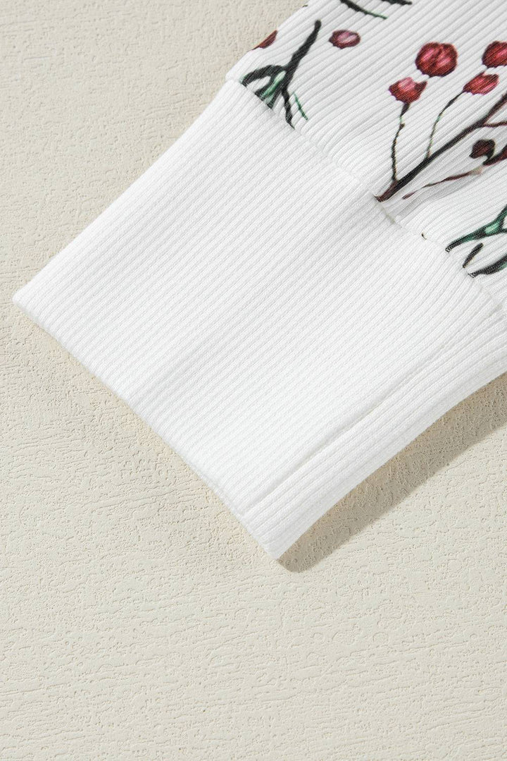 a close up of a white towel with flowers on it