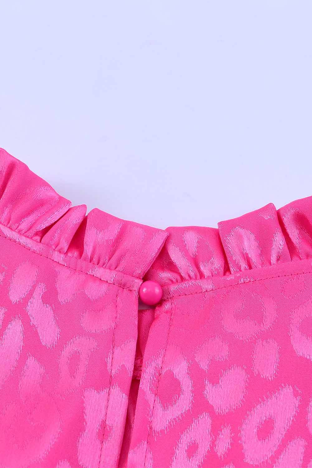 a close up of a pink leopard print skirt