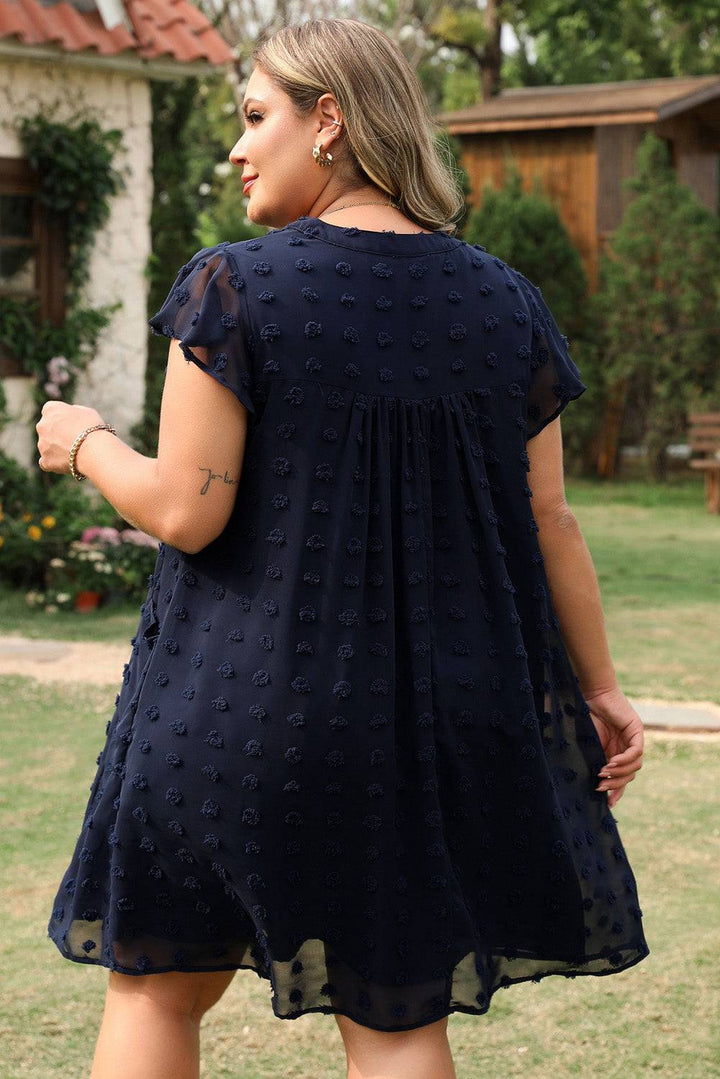 Back view of Navy Blue Dotty Textured Notched Neck Plus Ruffled Dress showing flowy silhouette and Swiss dot fabric, ideal for daily wear.