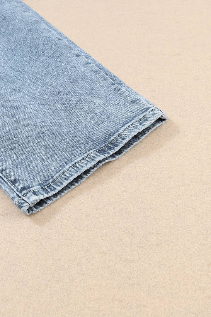 a pair of blue jeans laying on top of a table