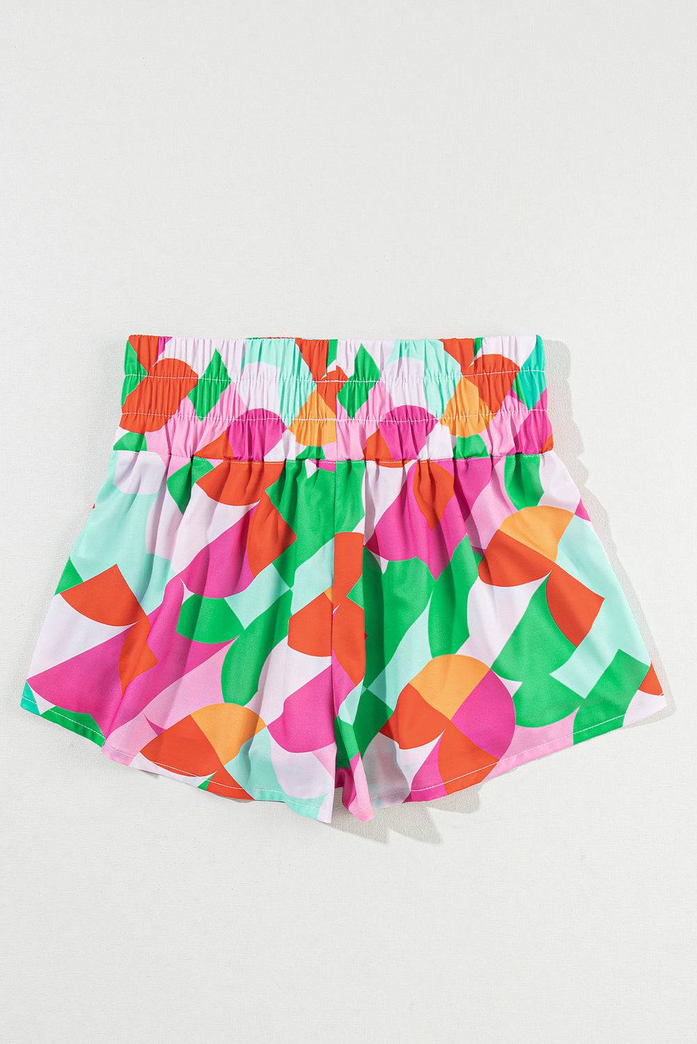 a pair of colorful shorts on a white background