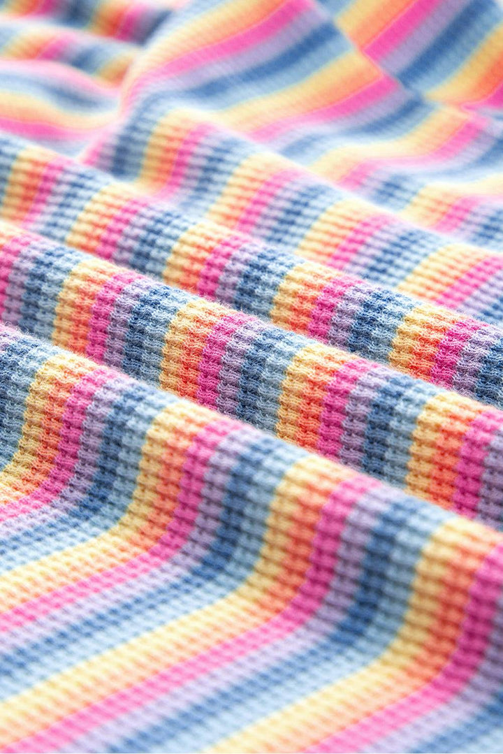 a close up of a colorful striped fabric