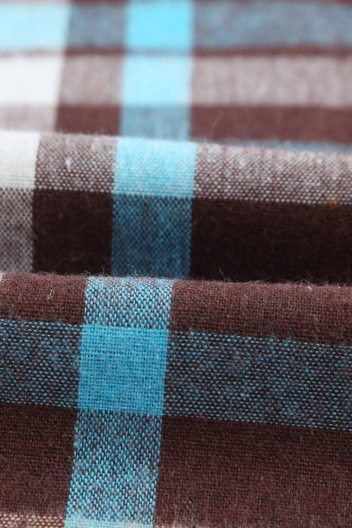 a close up of a blue and brown checkered fabric