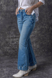 a woman in white shirt and jeans posing for a picture