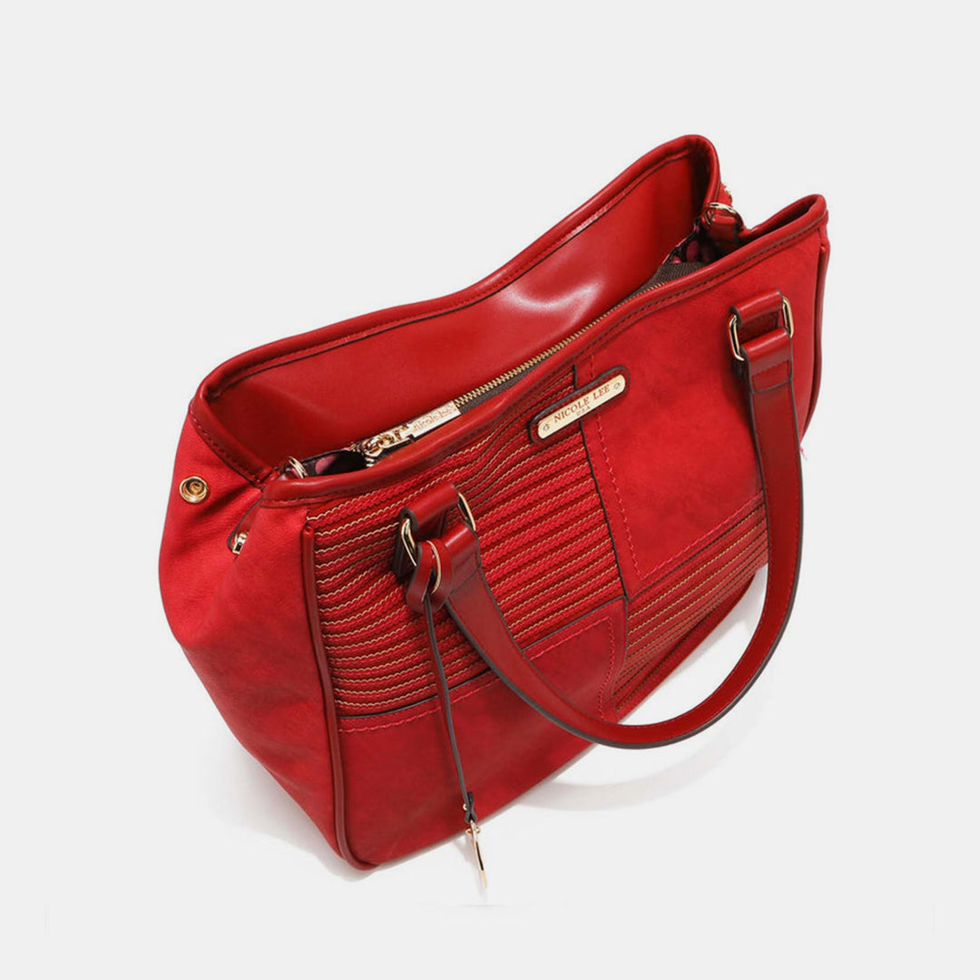 a red handbag is shown on a white background