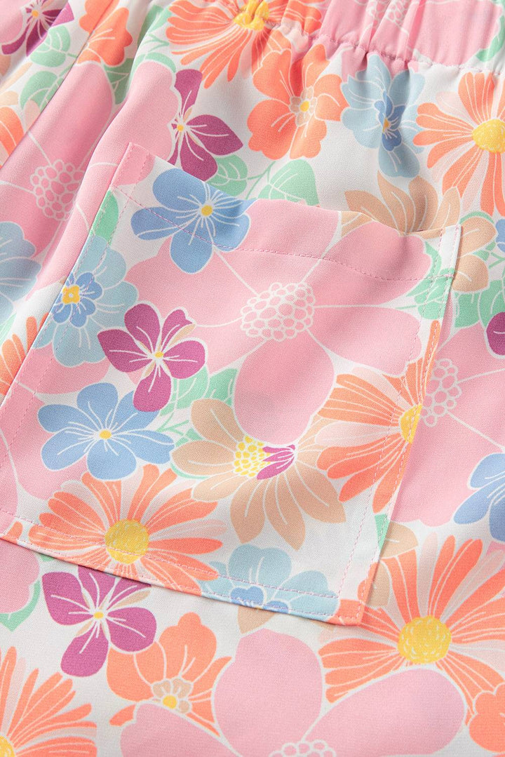 a close up of a flower print shorts