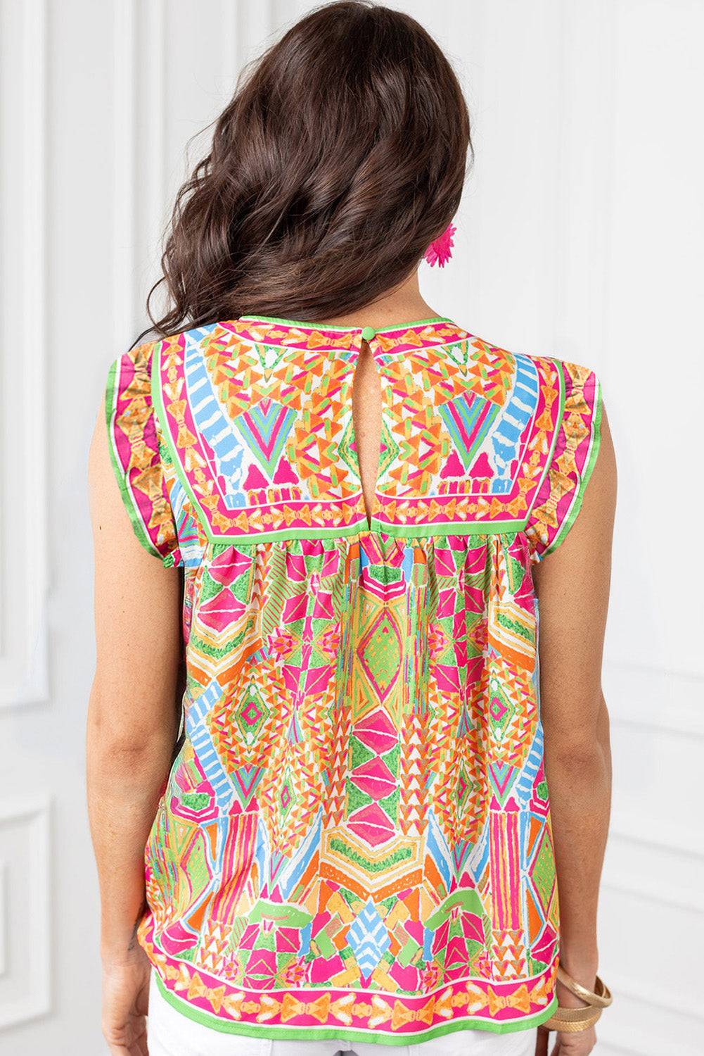 the back of a woman wearing a colorful top