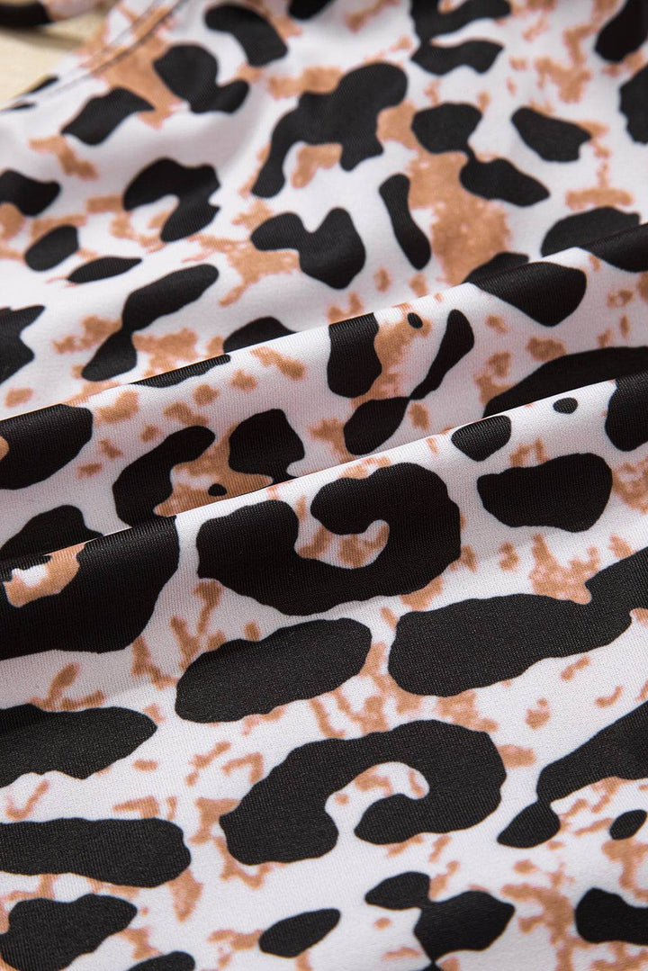 a close up of a black and white animal print fabric