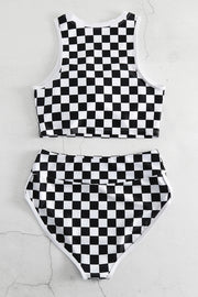 a black and white checkered bathing suit on a wall