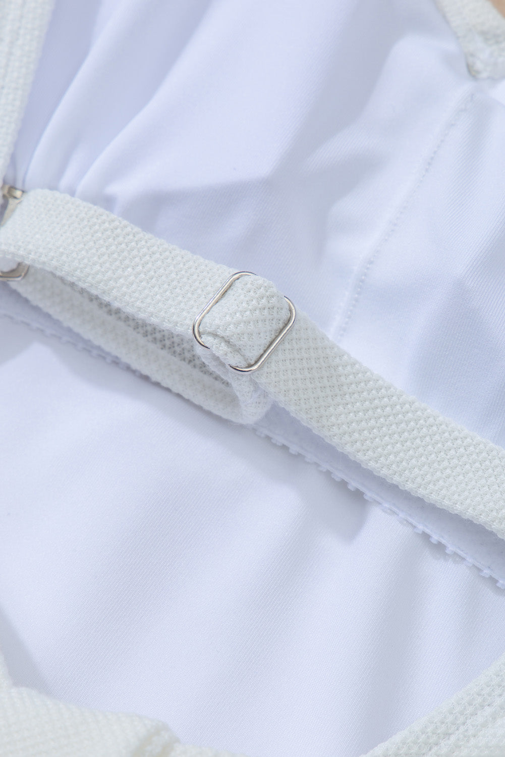 a close up of a white dress with straps